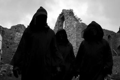 Shadowy figures in front of Oystermouth Castle