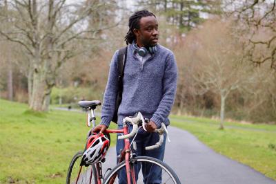 Man with bike and helmet.